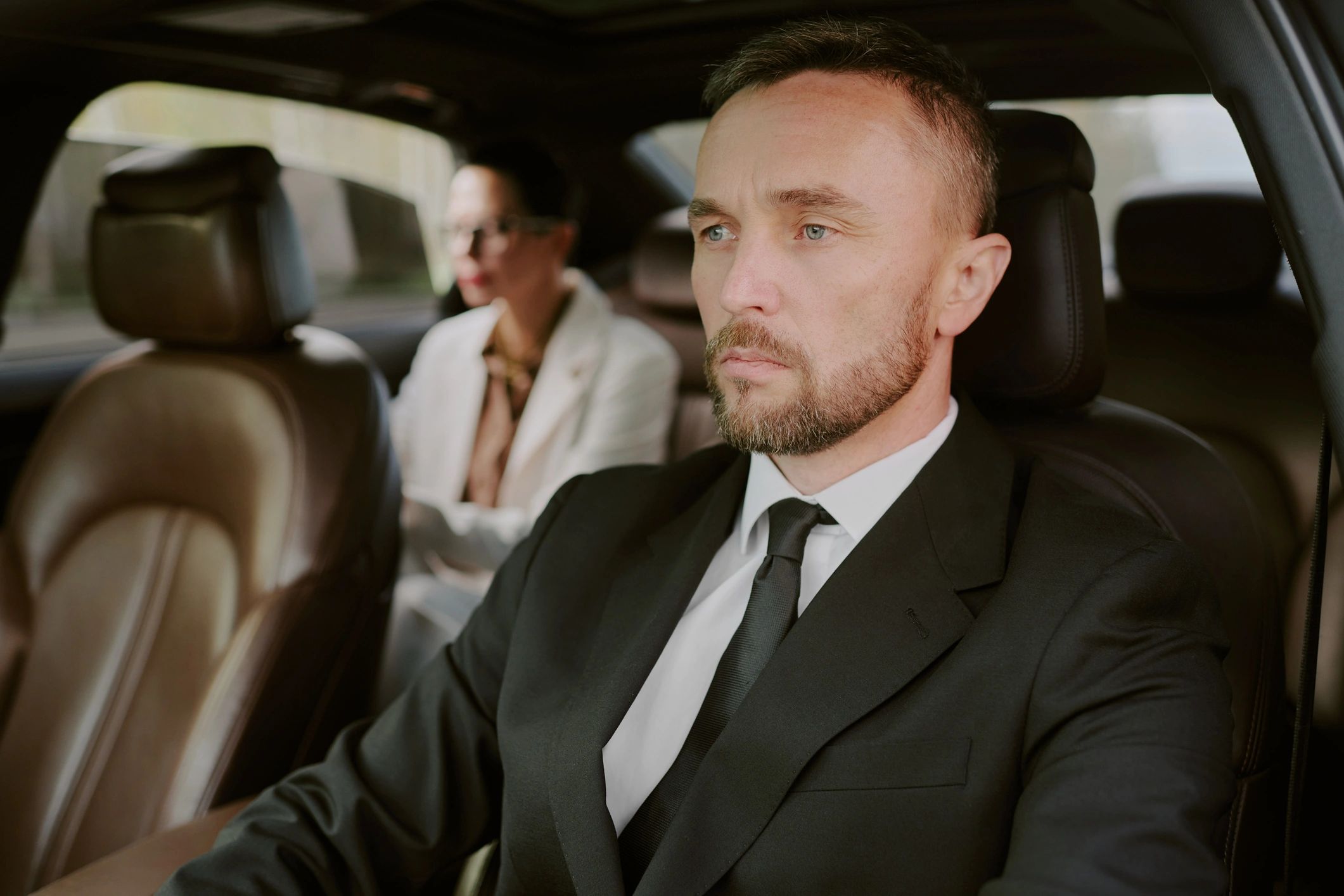 Executive in luxury vehicle interior